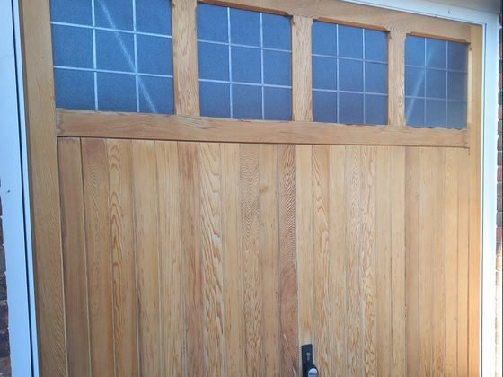 Garage doors sanded back to bare timber