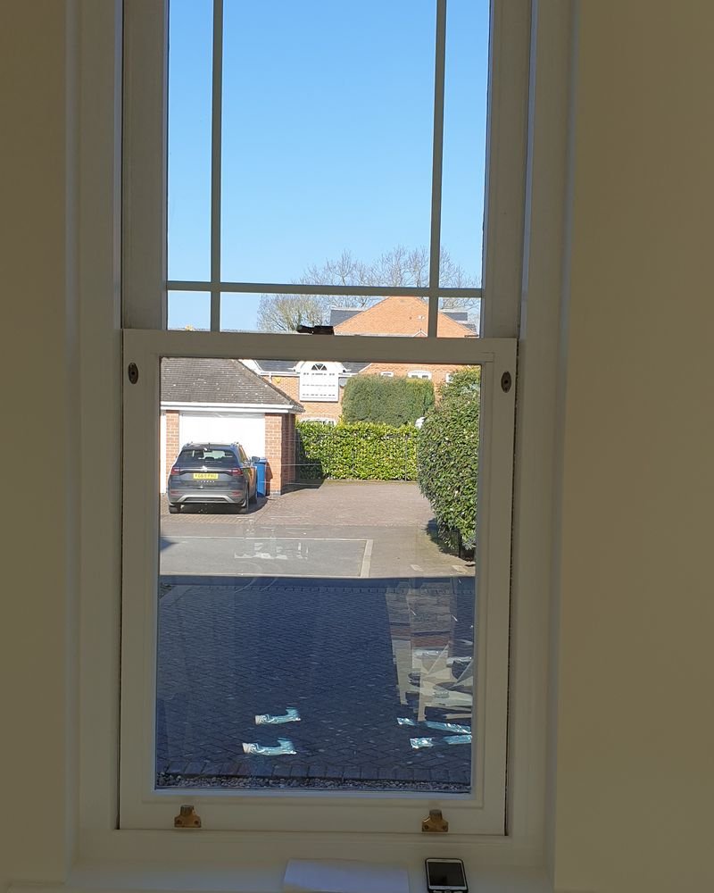 A restored timber sash window and painted reveal