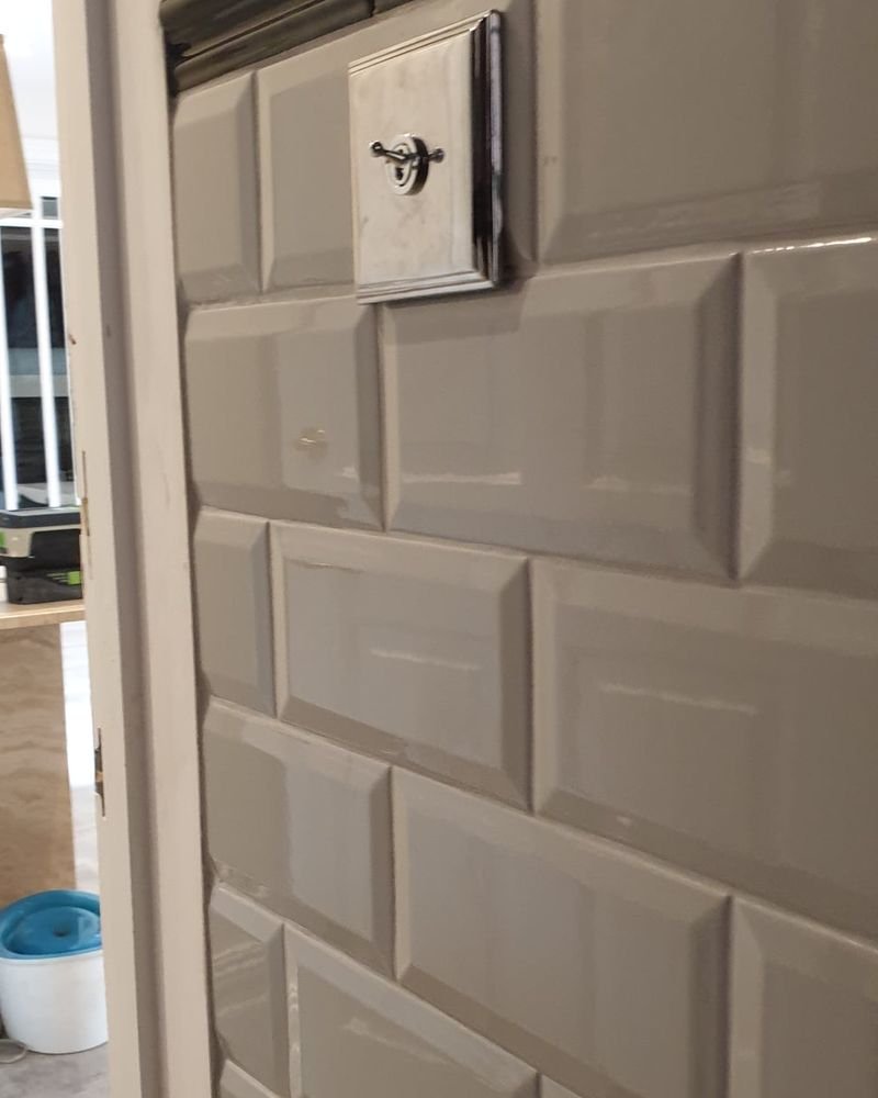 Metro tiling above a cloakroom basin