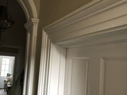 Restored panelled doors and moulded architraves in a period house