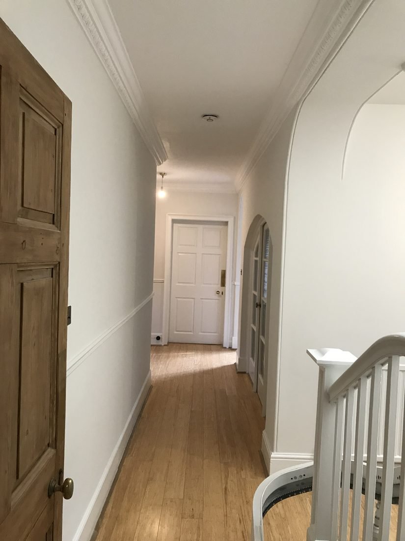 The same hallway after re-plastering, decorated and finished