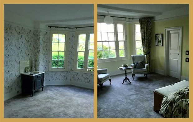 A bay-window bedroom papered in a trailing botanical print, seen from two sides